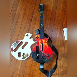 Guitar hero controller and extra cover plate